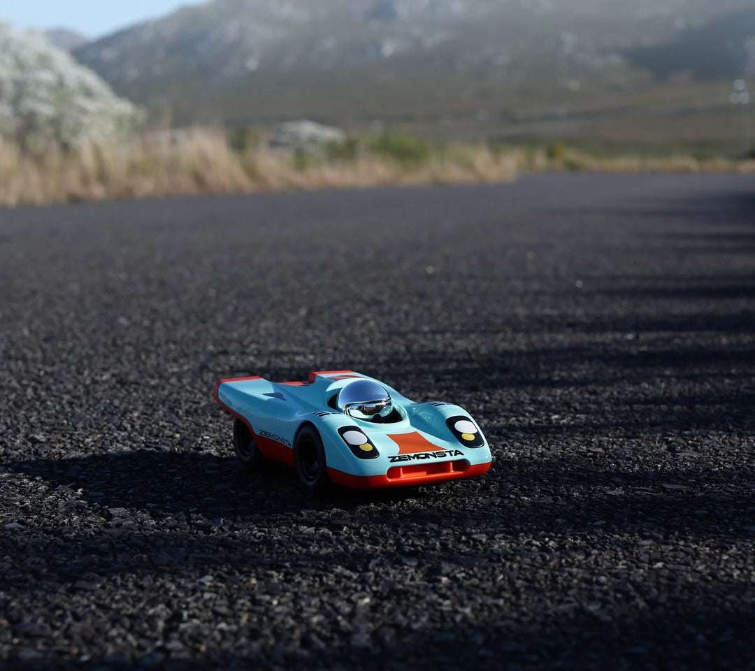 Playforever Zemonsta Klaus designer toy car with blue and orange racing-inspired finish