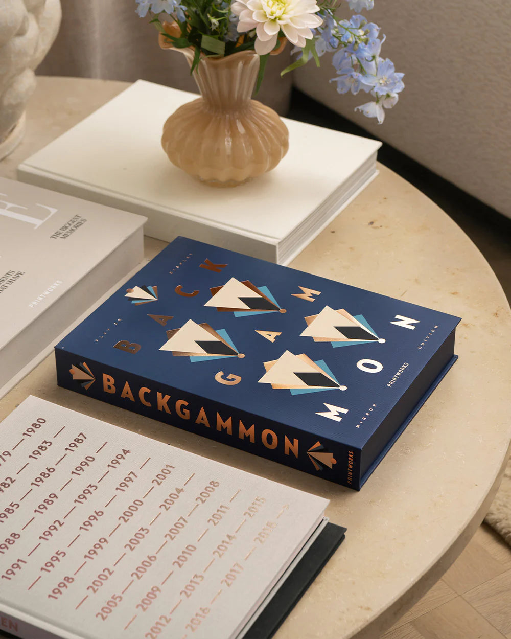 Art of Backgammon Mirror board game in dark blue and copper with mirrored playing surface and decorative coffee table design
