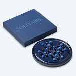 Wooden solitaire game with round board and marbles for classic strategy play