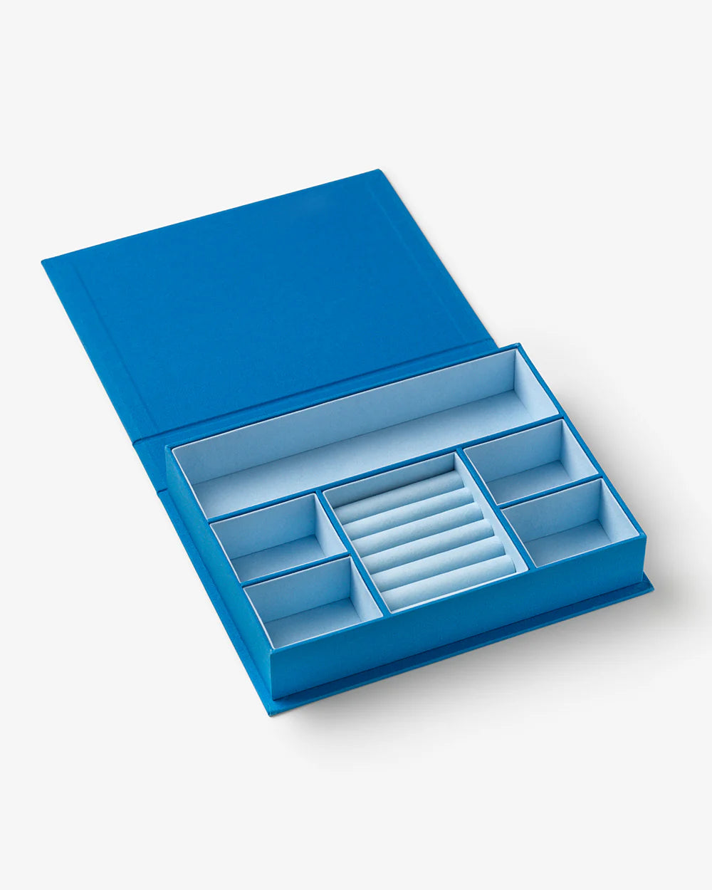 Blue jewellery box with book-inspired design and organised compartments for rings, earrings and necklaces