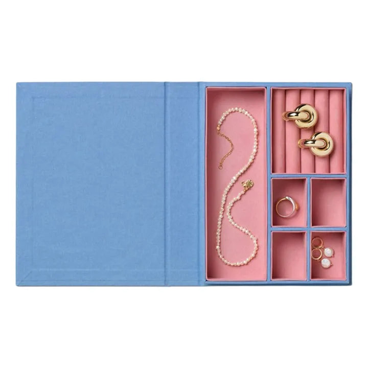 Sassy jewellery box in blue and pink with book-inspired design and organised compartments for jewellery storage
