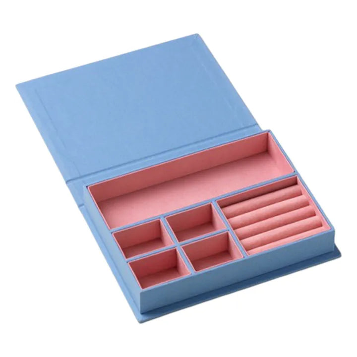Sassy jewellery box in blue and pink with book-inspired design and organised compartments for jewellery storage