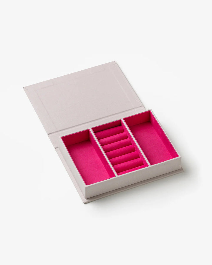 Glow jewellery box with soft pink velvet-lined compartments and elegant book-inspired storage design